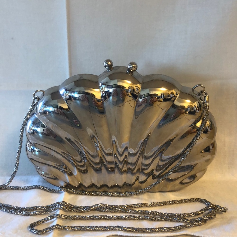 Metal clam shell cross body bag